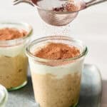 dusting cocoa on tiramisu overnight oats