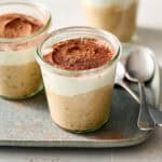 tiramisu overnight oats with ricotta in jars with cocoa powder on the side