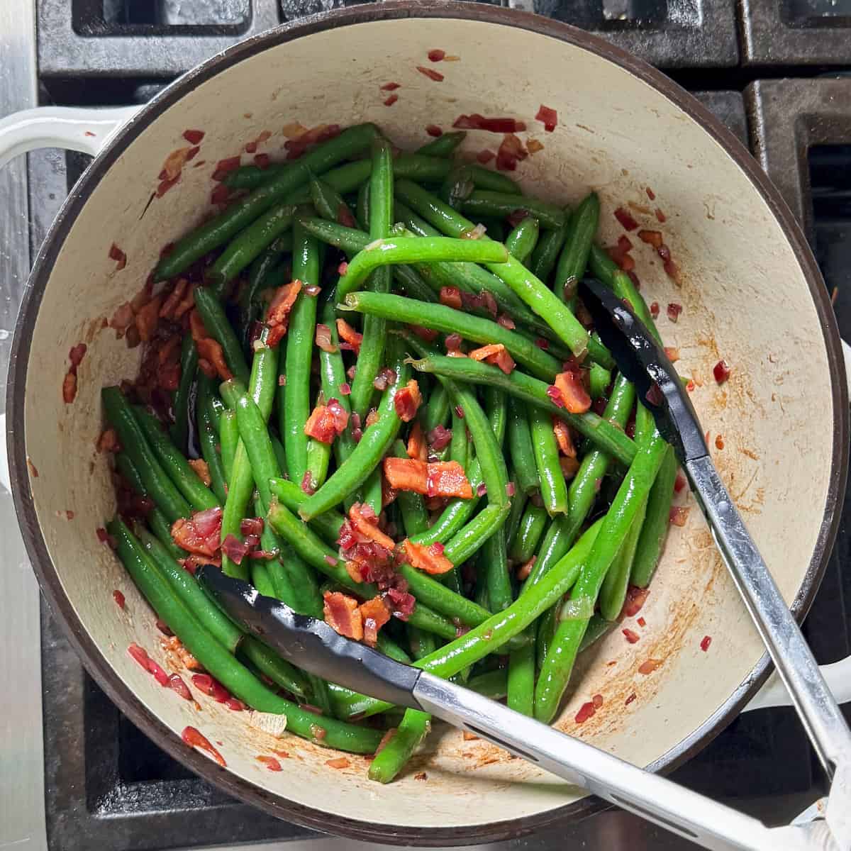 green beans added back into the pot with the dressing, bacon, onions and almonds