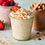 a jar of overnight oats made with cottage cheese topped with greek yogurt and berries