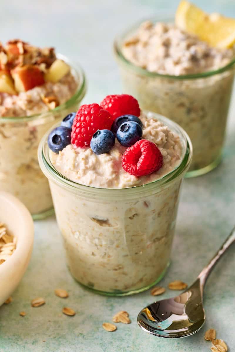 three varieties of greek yogurt overnight oats including regular, apple cinnamon and lemon poppyseed