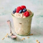 single jar of overnight oats topped with berries
