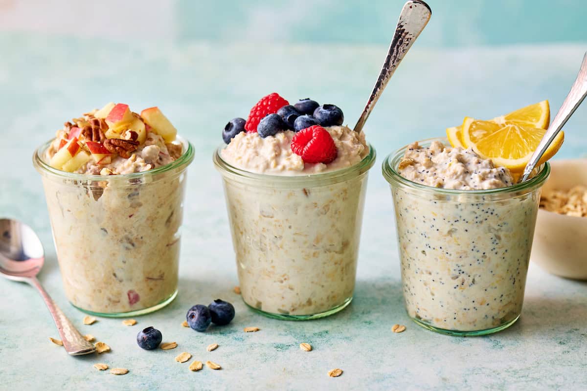 three varieties of greek yogurt overnight oats including regular, apple cinnamon and lemon poppyseed