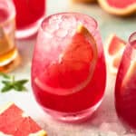 closeup of grapefruit mocktail with a slice of grapefruit in it