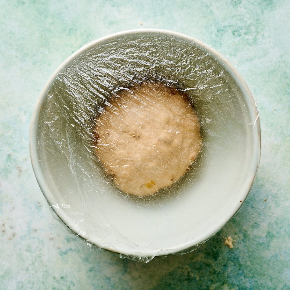 dough covered in a bowl before first rise