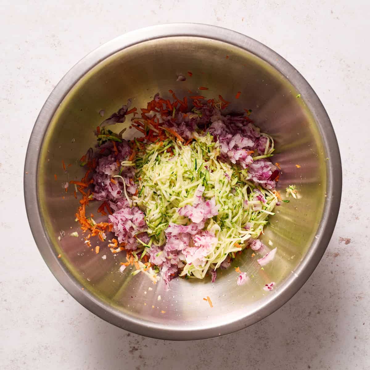 shredded carrots, onion and zucchini mixed together