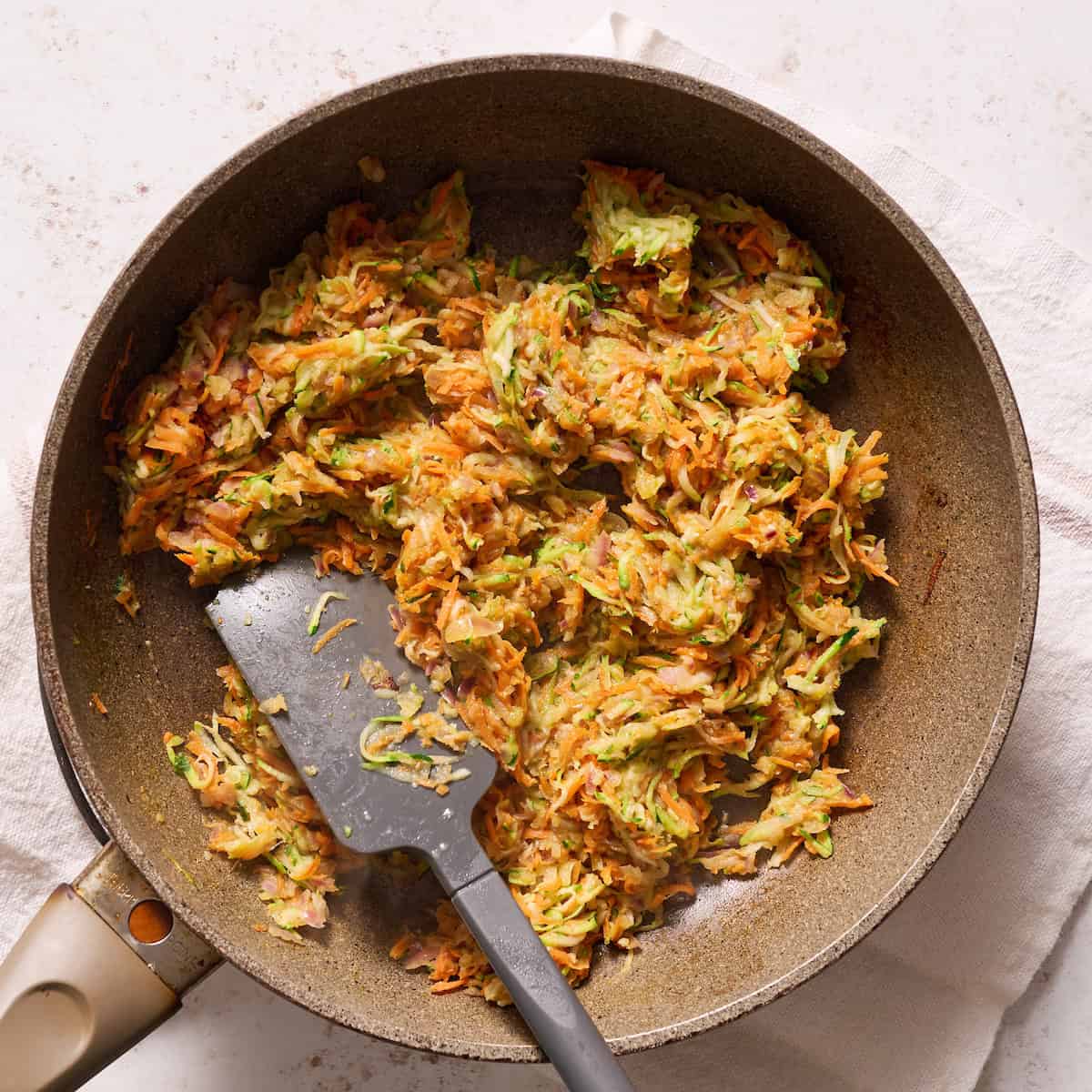 sauteing veggies in a pan with butter