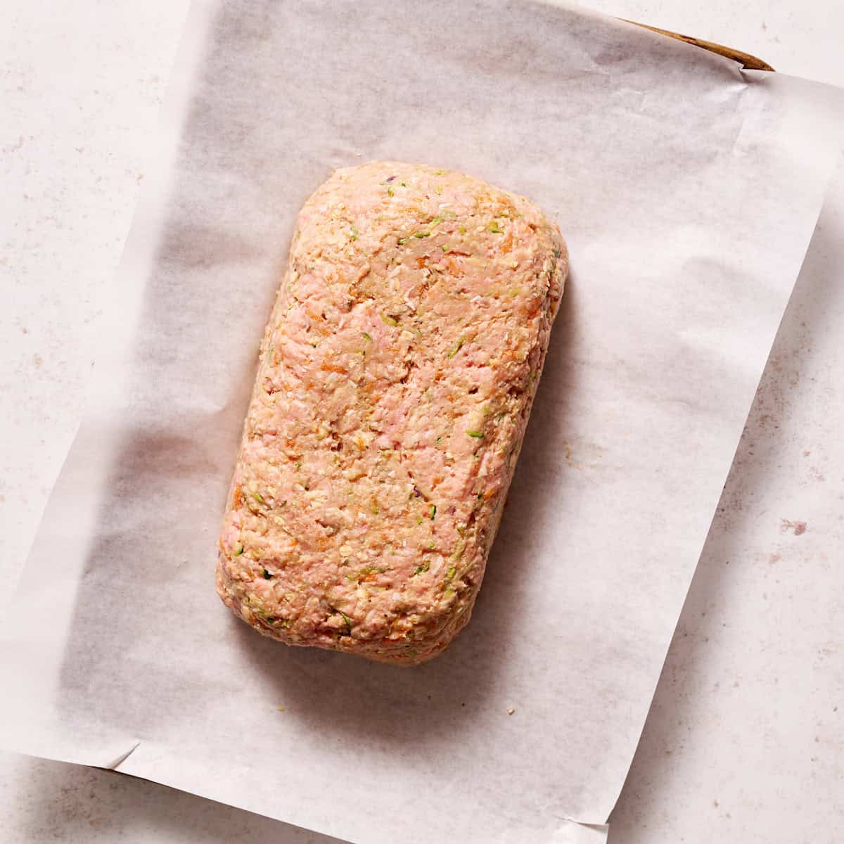 formed loaf on a cooking sheet lined with parchment