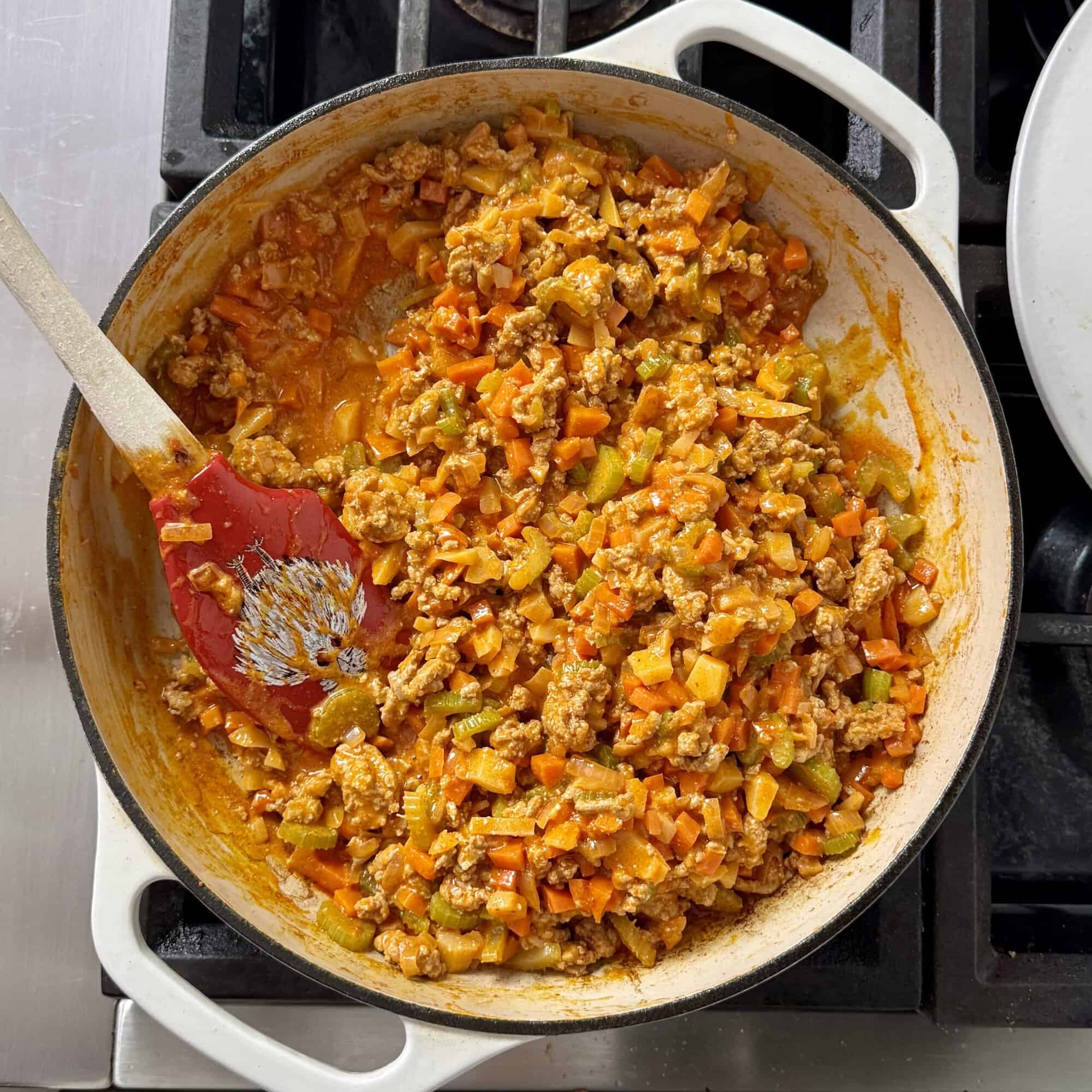 final sloppy joes with the sauce and cream cheese added in on the stovetop