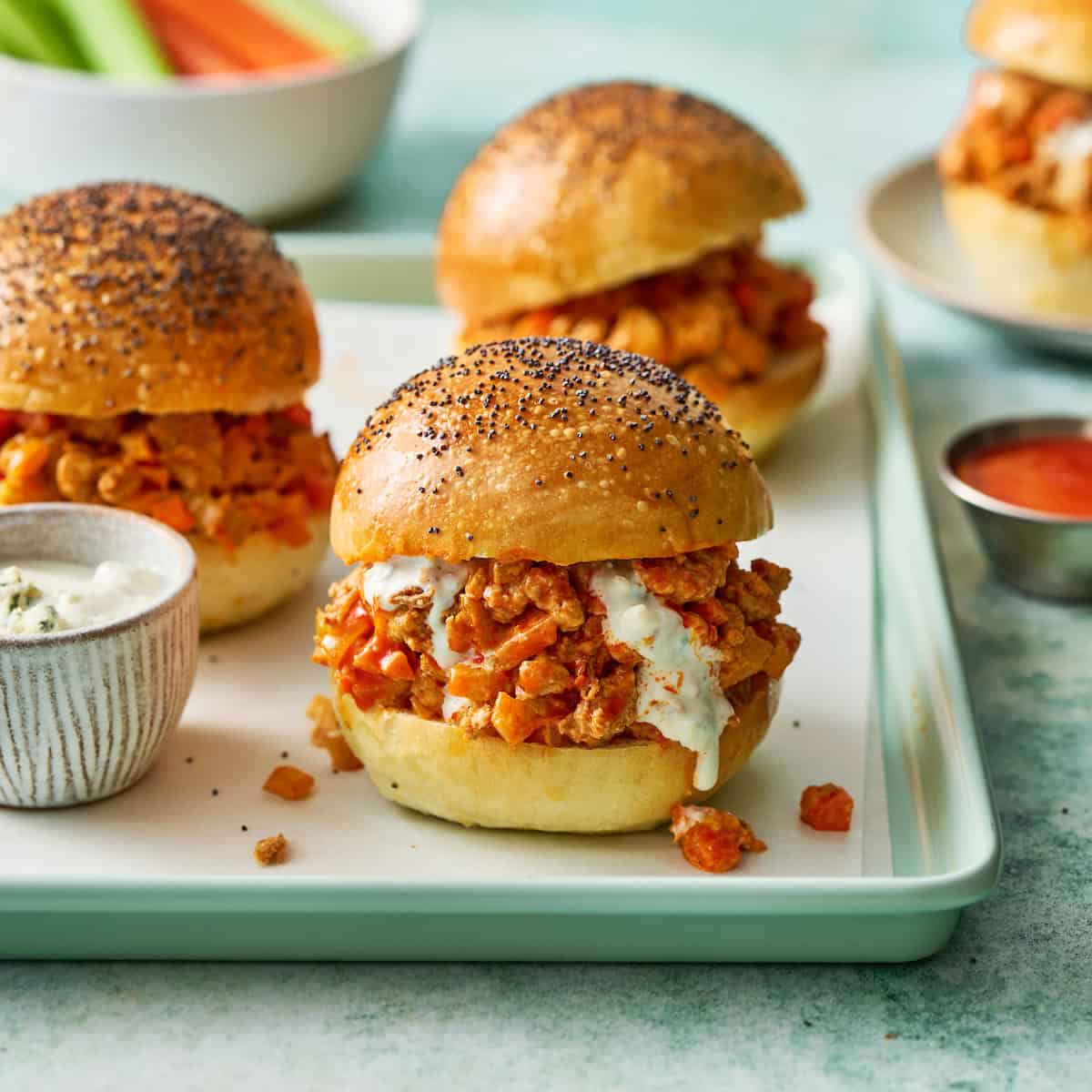 buffalo chicken sloppy joes on homemade sourdough rolls with blue cheese dressing