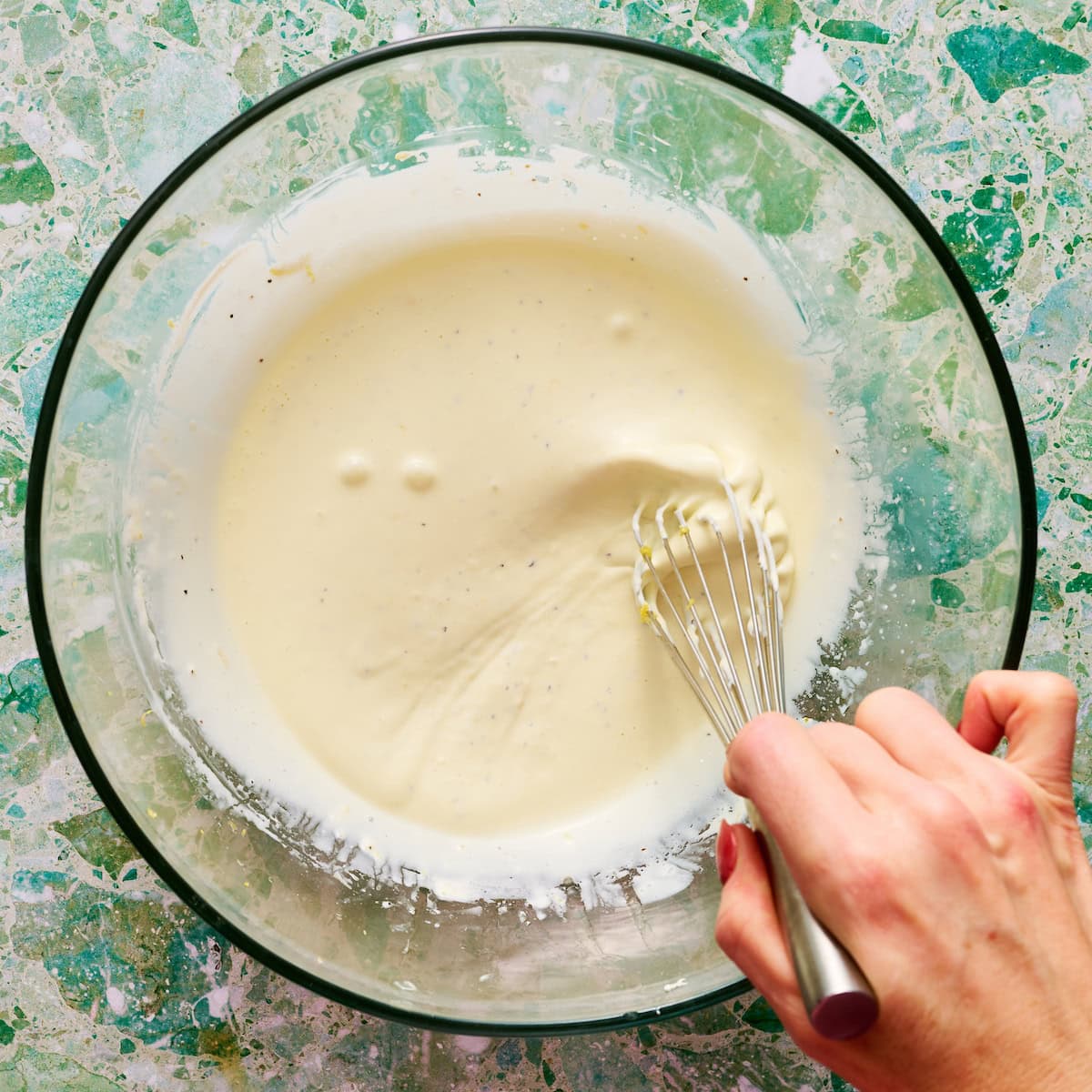 whisking the dressing ingredients together