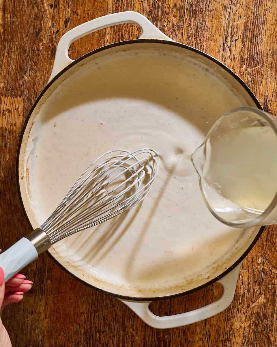 adding pasta water to the sauce