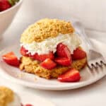 closeup of strawberry shortcakes with fresh whipped cream