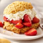 closeup of strawberry shortcakes with fresh whipped cream