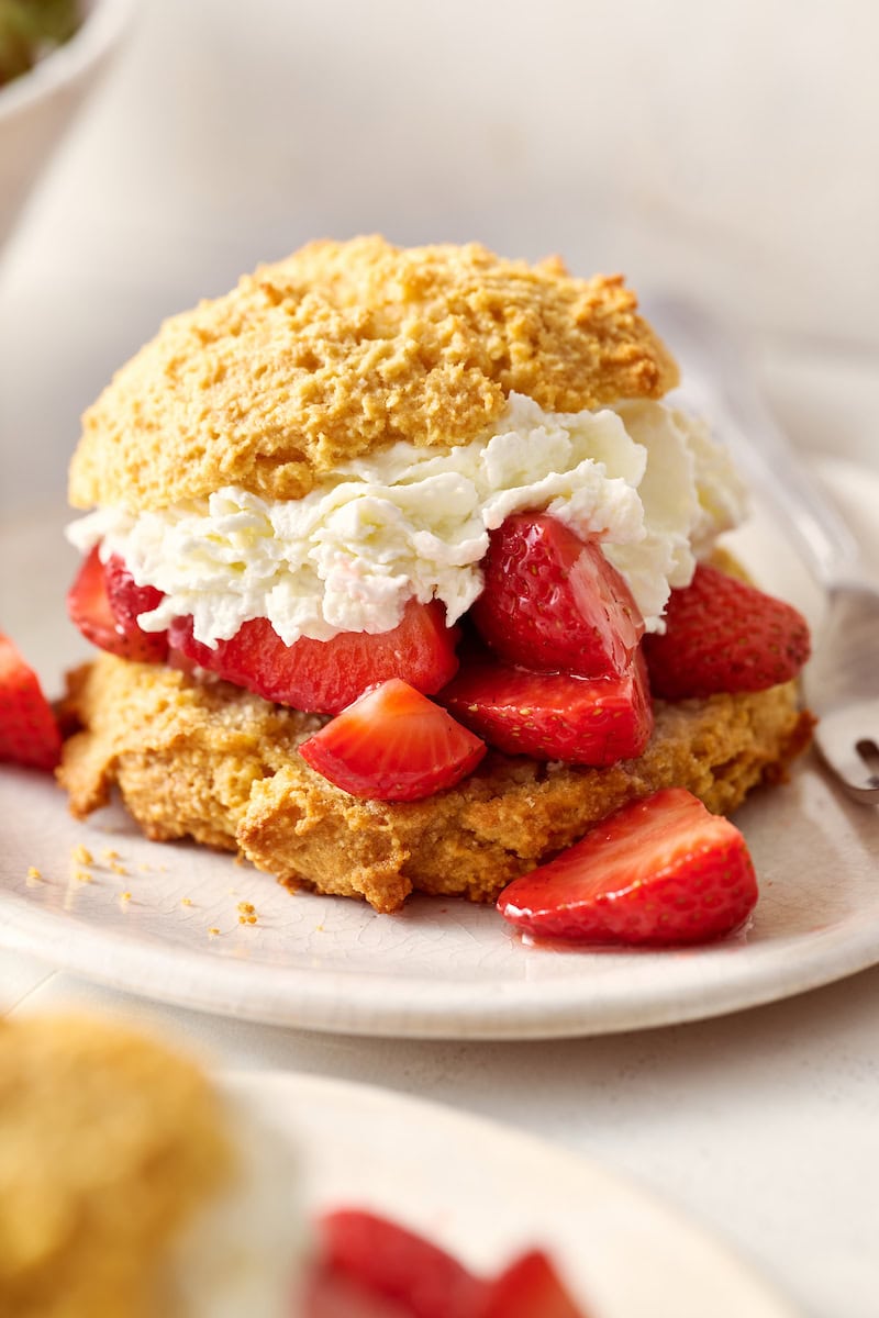 closeup of strawberry shortcakes with fresh whipped cream