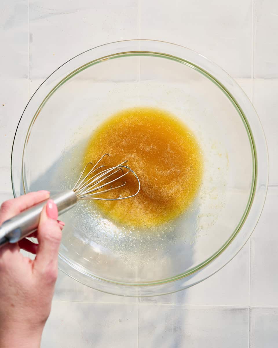 whisking egg with vanilla and honey