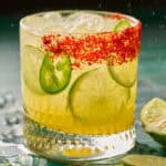 margarita mocktail garnished with lime and jalapeno