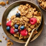 granola in a bowl with yogurt and fruit